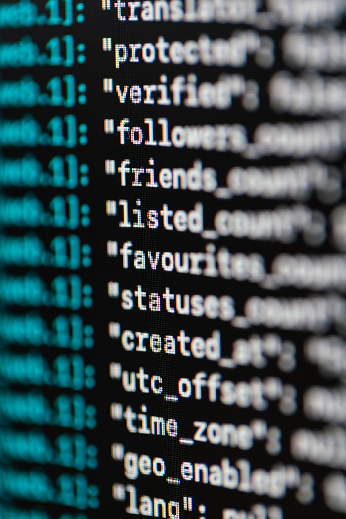 About Extreme close-up of computer code displaying various programming terms and elements.